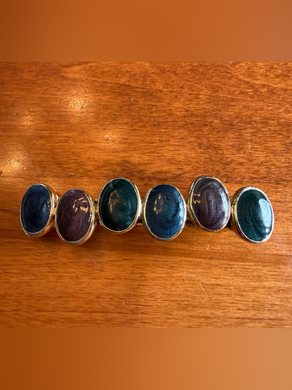 Gold-Tone Oval Stone Barrette with Deep Green and Blue Stones